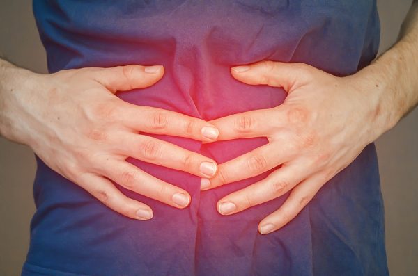 A Man Holding His Stomach. Pain In The Stomach, Stomach, Intesti