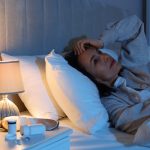 Mature Woman Suffering From Insomnia In Bed At Night