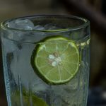 A Glass Of Cold Lemon Water With Ice Cubes In A Clear Glass Of G
