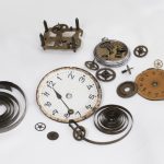 Disassembled Parts Of An Antique Clock, Clock Hands, Gear Wheels