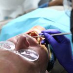 Dentist Examines Mouth