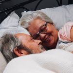 Happy Older Couple in Bed